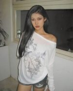 White korean off shoulder t-shirt with floral print, worn by a woman.