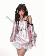 Off shoulder sport sweatshirt featuring 'COQUETTE' text, showcasing a trendy aesthetic.