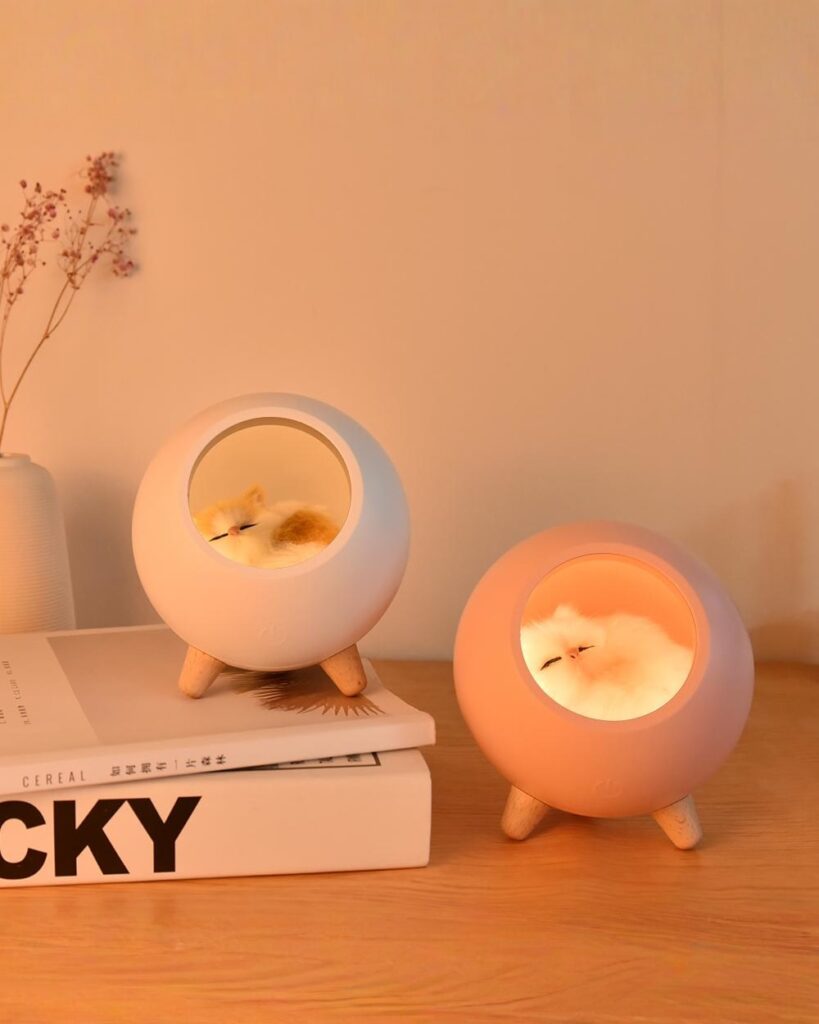 Two kawaii cat lamps from Little Pet House® featuring sleeping cats inside.