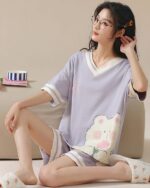 Purple kawaii bear pajamas set with shorts and a t-shirt, featuring a cute bear design.