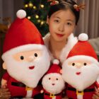 Christmas plushie decor featuring Santa Claus plush toys in a festive setting.