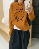 Orange puppy doodle sweater featuring a cute dog illustration.