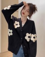 Black korean cardigan with oversized flower embellishments.
