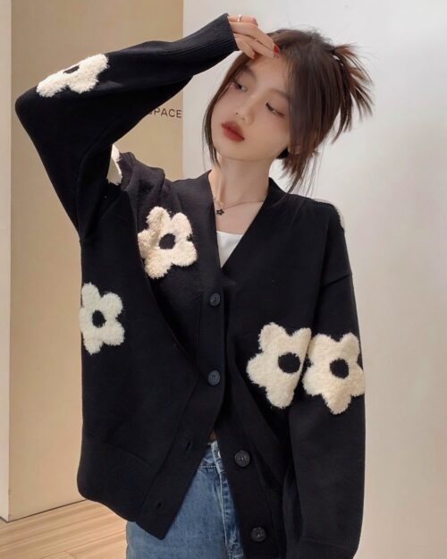 Black korean cardigan with oversized flower embellishments.