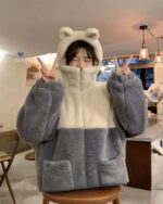 Warm bear ear jacket featuring a fluffy, oversized design with two large bear ears and pockets.