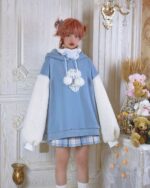 A blue kawaii lamb hoodie with fluffy white sleeves and a cute lamb hood detail.