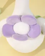Close-up of Kawaii Molly the Little Flower duck plushie toy, featuring a purple flower design.