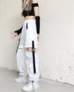 Detachable y2k aesthetic pants, white, with adjustable straps and cargo pockets.