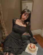 Black lace gothic aesthetic dress with long sleeves, featuring a fitted bodice and flowing skirt.