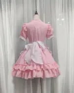 Pink Japanese maid dress with ruffles and a white apron, kawaii aesthetic.