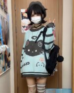 Mint neko sweater featuring a cat graphic, worn as part of a Harajuku style outfit.