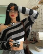 Black and white retro aesthetic sweater featuring an off-the-shoulder design.