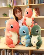 Set of kawaii dino plushies in various colors, ideal aesthetic room decor.