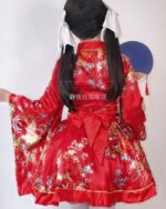 Red kawaii short yukata with floral print, tied sash, and decorative sleeves.