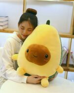 Yellow kawaii avocado plushie, soft and huggable toy.