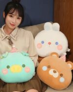 Round animal hand warmer plushies in teal, white, and brown colors. Cute, soft, and perfect for warmth.