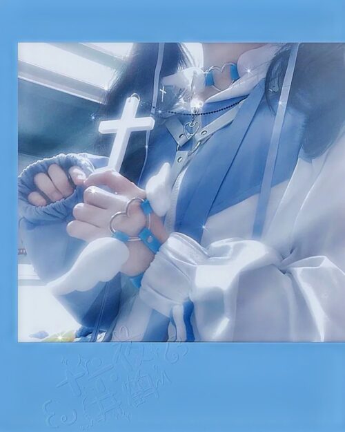 Close-up of a person wearing winged love bracelets, featuring a Harajuku aesthetic.