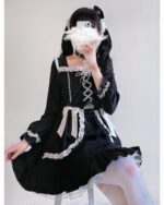 Black lace gothic lolita dress with puff sleeves and trim.