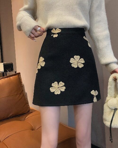 Black floral-embroidered korean aesthetic skirt with high waist.