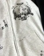 Gray animecore cardigan hoodie with a cartoon illustration and text.