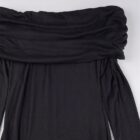 Close-up of a black gothic aesthetic dress with a draped wrap detail.
