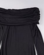 Close-up of a black gothic aesthetic dress with a draped wrap detail.