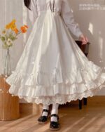 White gothic lolita ruffled skirt with lace details, high waisted design.