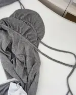 Close-up of a gray dark gyaru set with tie closures.