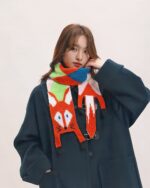 Cute fox scarf featuring a colorful knitted design with a cottage aesthetic.