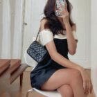 Black satin french aesthetic dress with a white collar and bow detail.