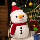 Cute snowman christmas plushie decor, festive holiday decoration with hat and scarf.