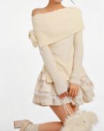 Cream off-the-shoulder knit sweater paired with a ruffled skirt, part of the kawaii clothing set.