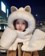 Woman wearing a white fox ears scarf at night. Fox ears scarf detail.