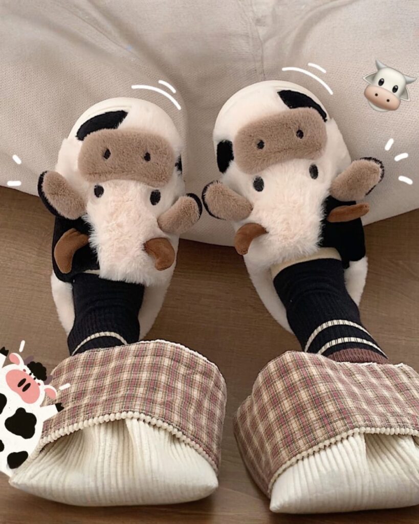 Cute plush The Cow Slippers featuring a plaid lining and cow design.