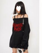 Black gothic aesthetic sweater with ripped detailing and a red graphic. Off-shoulder style.