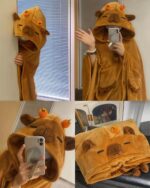 A tan capybara cloak with hood and ears, a kawaii clothing item.