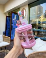 Close-up of a kawaii bear bottle - U Cup, featuring a bear charm and balloon decoration.