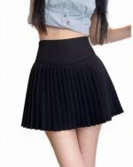 Black korean pleated skirt, high waist style, preppy aesthetic.