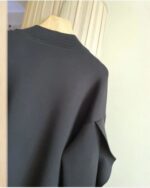 Black lace cardigan kawaii on hanger, long sleeve.