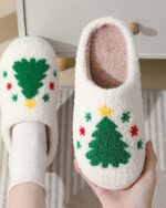 White christmas plushy slippers with a festive tree design.