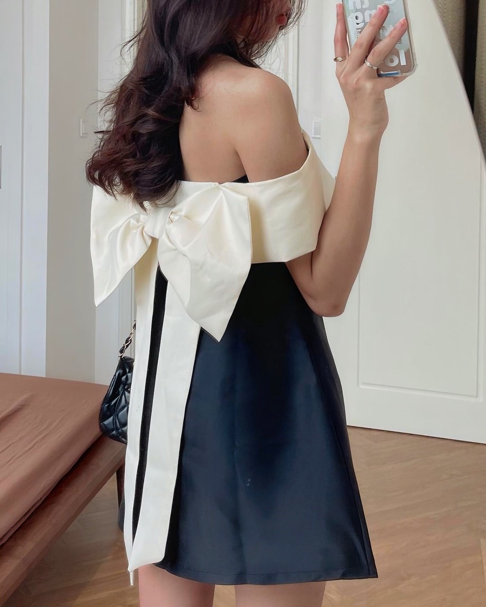 Black and white single bow dress, a French aesthetic dress, featuring a flowing bow detail.