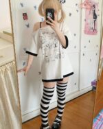 Model wearing a harajuku kawaii t-shirt with illustrations and striped socks.