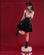 Black Dark Bowed Dress - Kawaii Goth, velvet dress with bow accents, posing on a box.