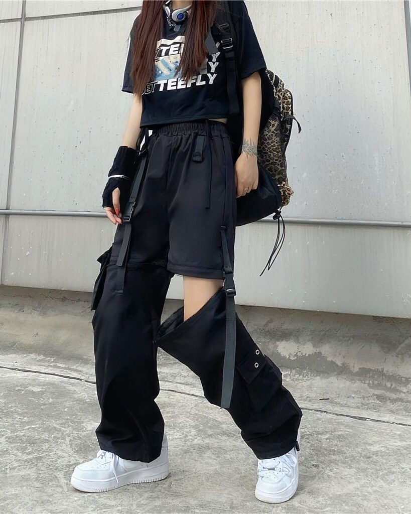 Black detachable y2k aesthetic pants with multiple pockets and adjustable straps.