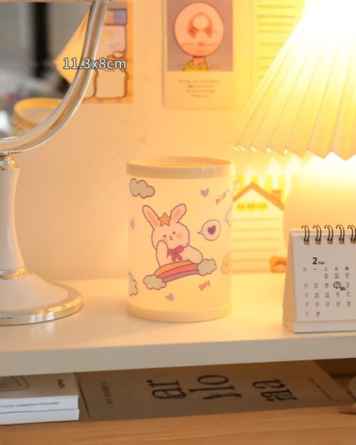 Kawaii pen holder featuring cute animal illustrations on a light yellow surface, measuring 11.3x8cm.