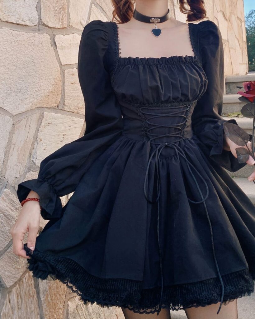 Black french aesthetic dress with lace detailing, puff sleeves, and corset lacing.