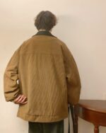 Back view of a brown corduroy korean college jacket with a preppy aesthetic.