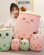 Set of cute bubble tea plushies in various sizes and colors, resembling milk tea cups.