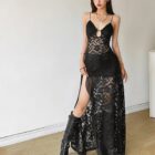 Black gothic aesthetic dress with sheer lace and a slit.