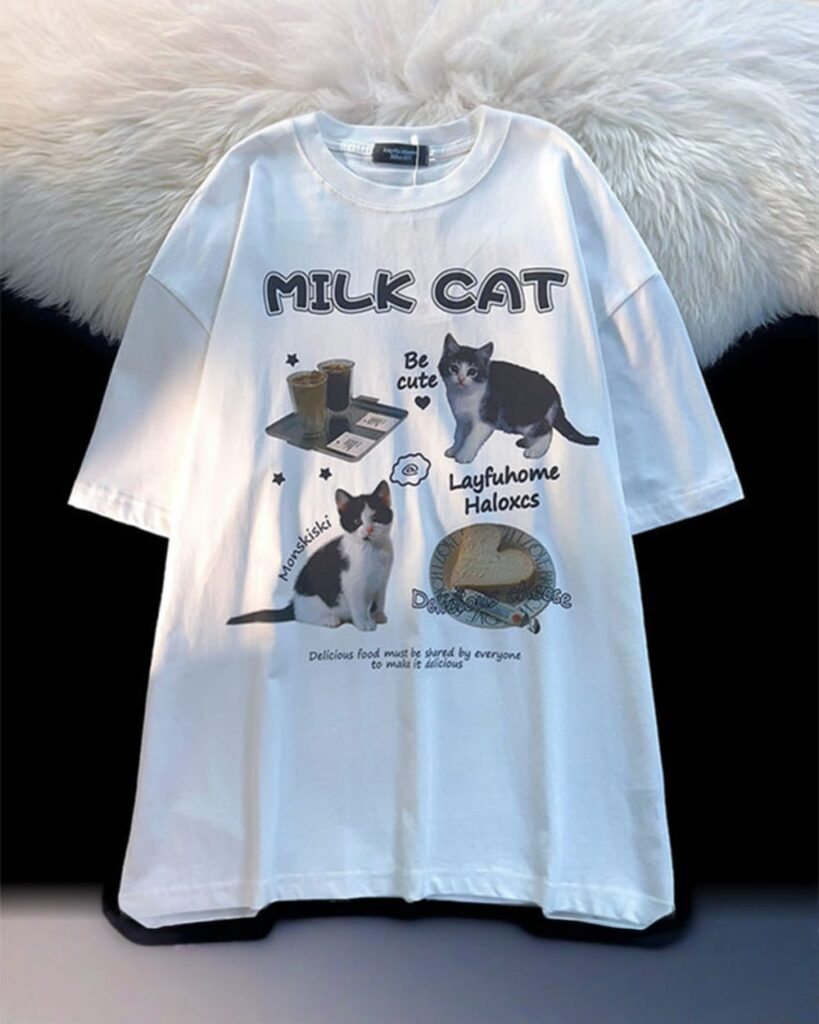 White t-shirt featuring a 'milk cat' design with illustrations and text.